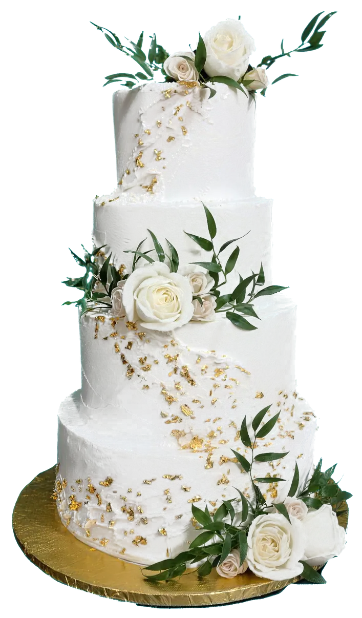 A tall four-tier white cake with roses, greenery and gold leaf