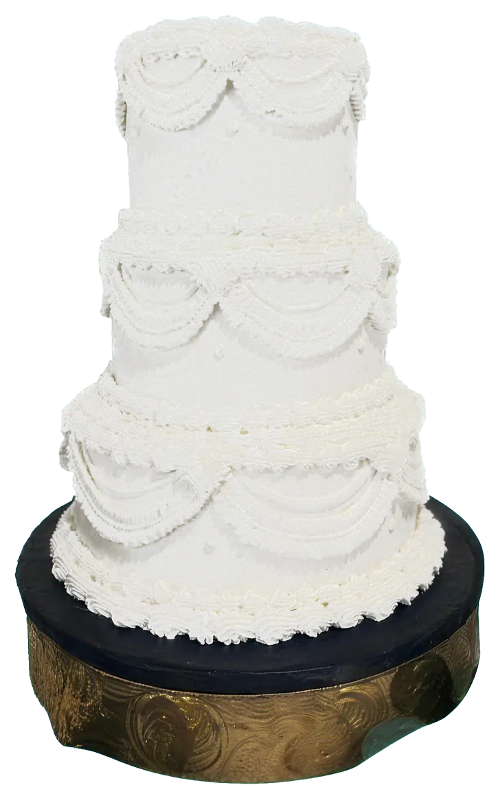 A vintage-piped three-tier cake with swags on a bronze stand